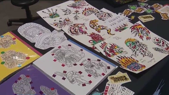 Checking out the tattoo artwork and designs