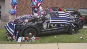 Growing memorial for fallen Officer Corder