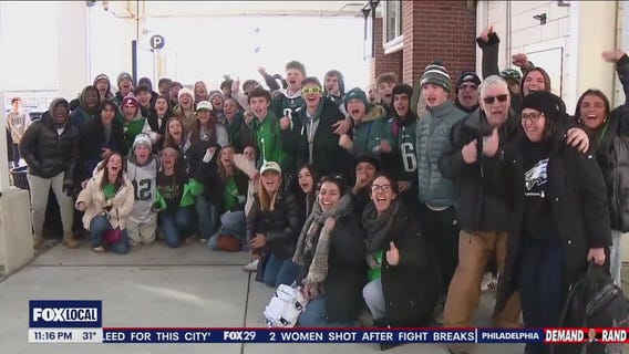 Fans cheer public transportation making their way to and from parade