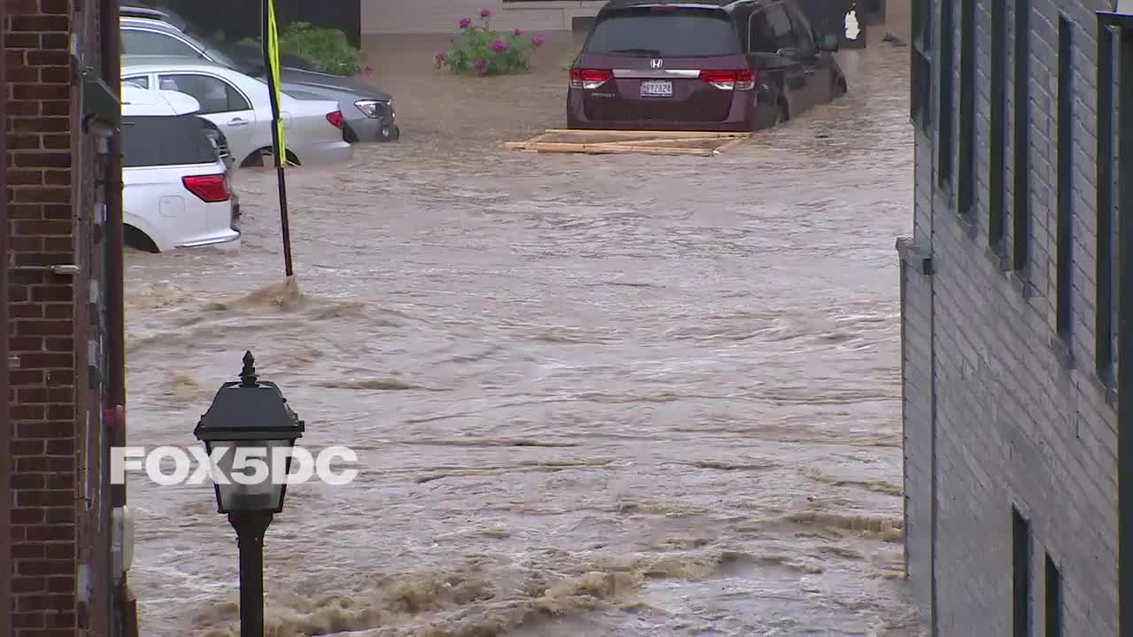 Cars and streets swallowed by water in Ellicott City