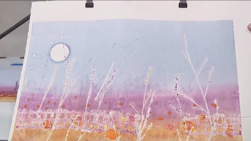 Artist demonstrating his work