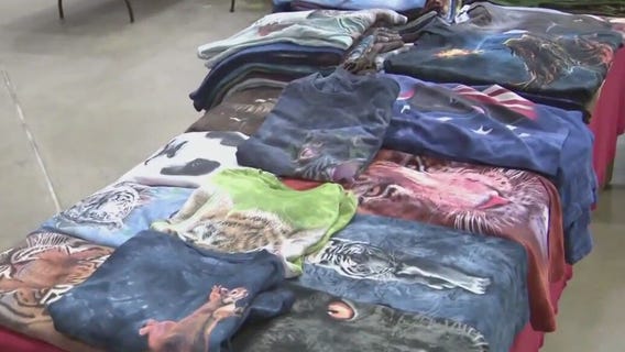 Checking out some clothing at Rummage-O-Rama