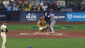 Sign seen by millions during Brewers-Cubs game stirs curiosity