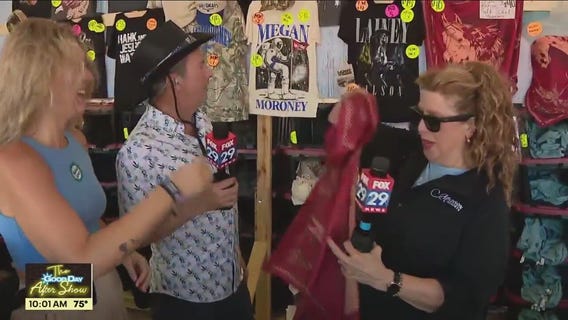 Bob and Sue preview the merch at the Barefoot Country Music Festival