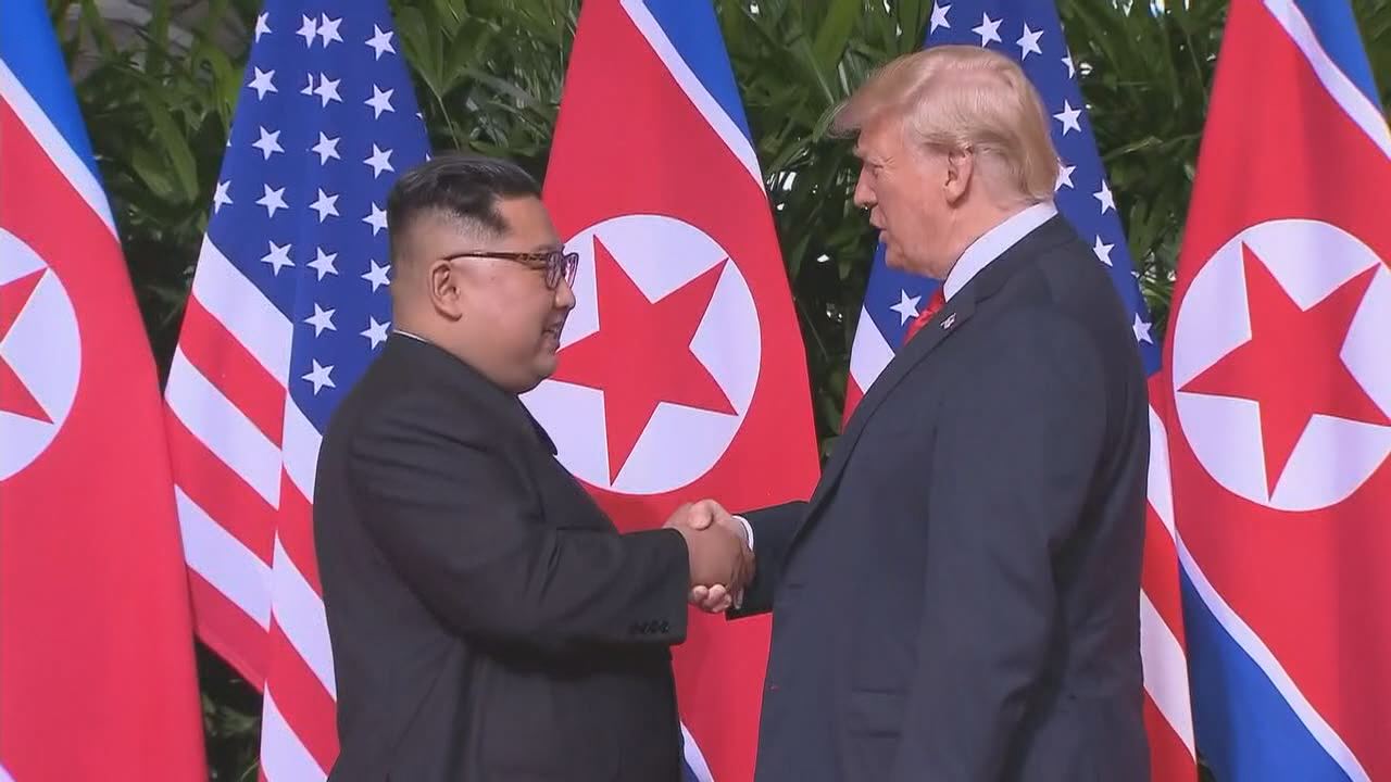 Trump shakes hands with North Korea's Kim Jong Un to kick off historic summit