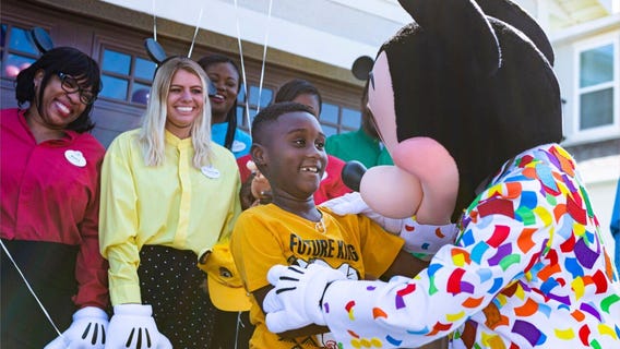 Boy who donated Disney savings surprised with free trip