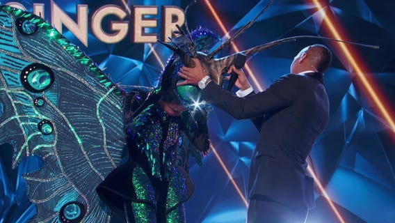 See the celebrity under the butterfly mask