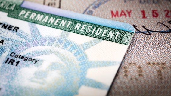 Justices allow enforcement of new green card rule