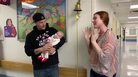 Mom helps infant daughter ring bell after brain cancer