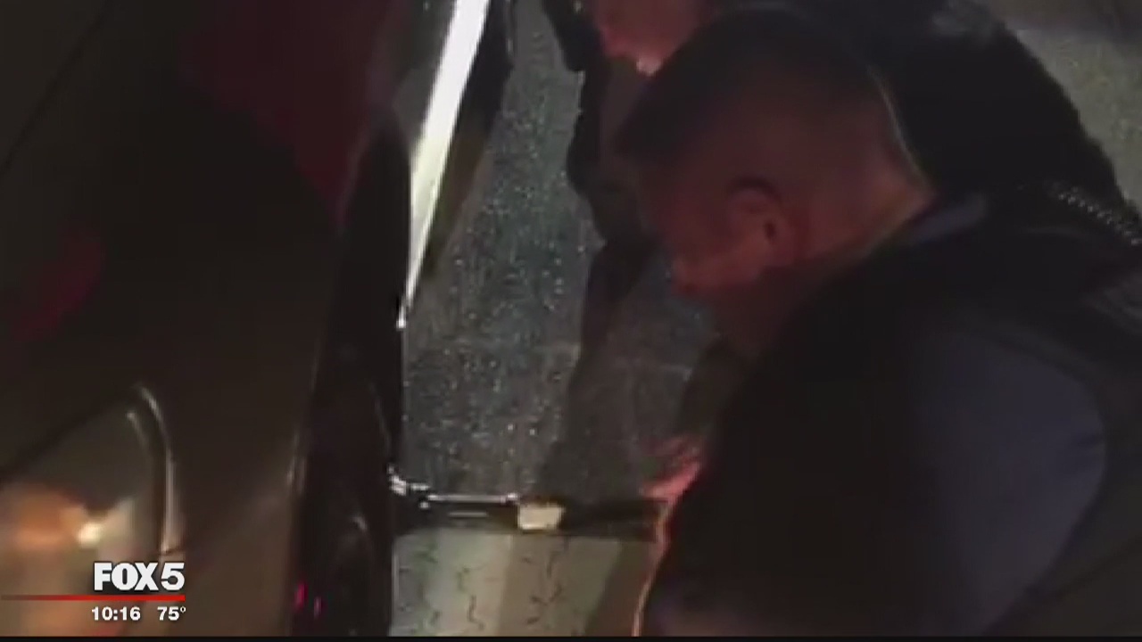Prince George's County police help man change blown tire
