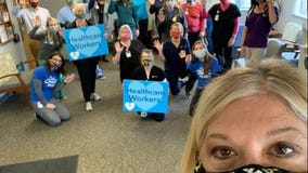 Woman sets up giving tree of face masks amid pandemic