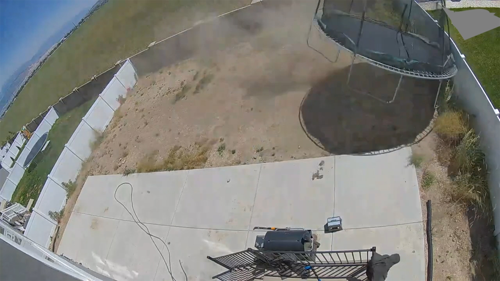 Dust devil flips over and breaks trampoline