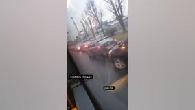 Cars line up at gas station in Ukraine as Russia launches military operation
