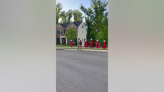 Pro-choice protesters march near Justice Barrett's home dressed in 'Handmaid's Tale' costumes