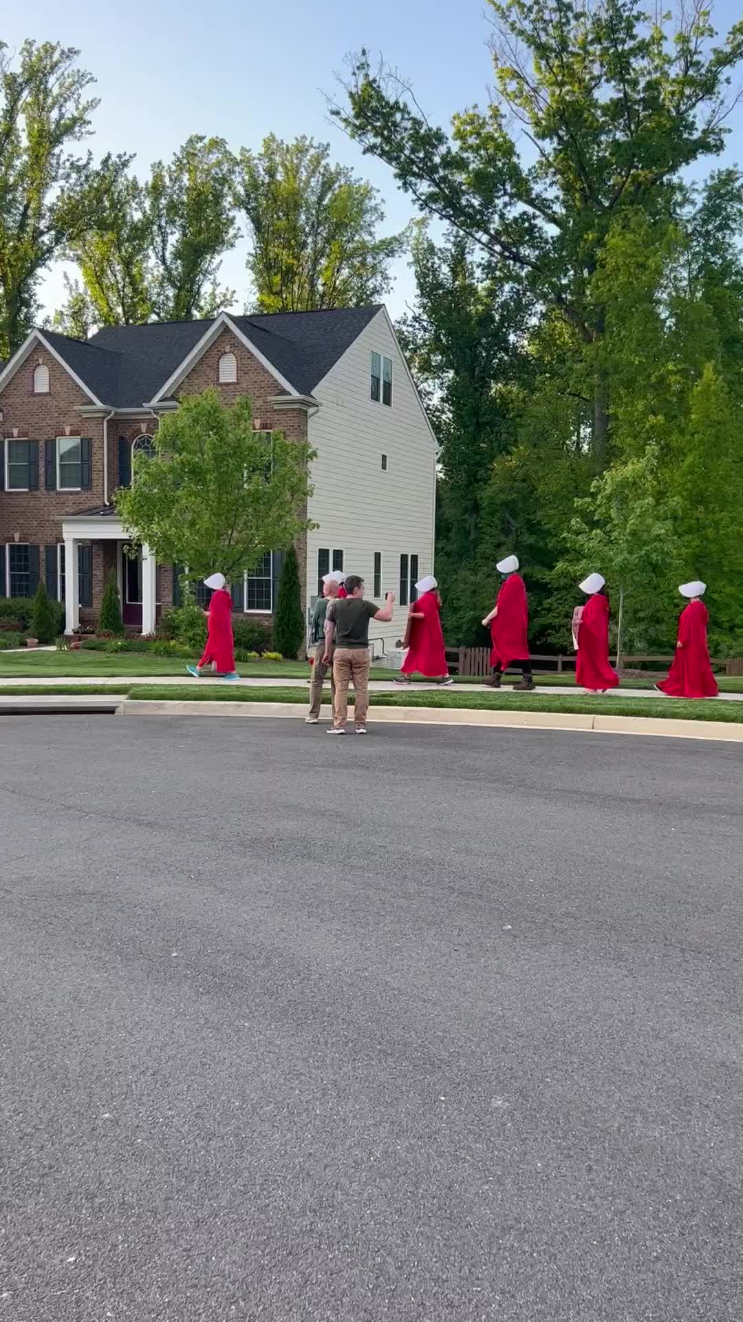 Pro-choice protesters march near Justice Barrett's home dressed in 'Handmaid's Tale' costumes