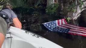 Deputies pull US flag from swollen river in Florida