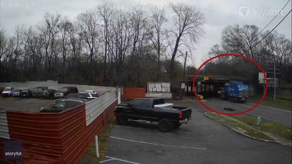 Video captures garbage truck hit overpass, burst into flames