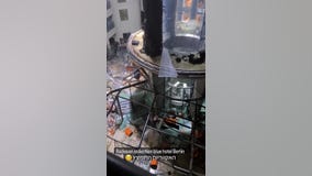 Large aquarium containing 264,000 gallons of water explodes at Berlin hotel