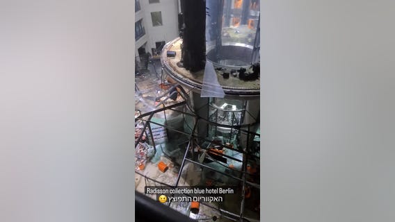 Large aquarium containing 264,000 gallons of water explodes at Berlin hotel