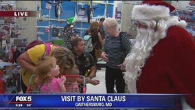 CHRISTMAS IN JULY: Santa makes summertime visit to seriously ill children at The Children's Inn at NIH