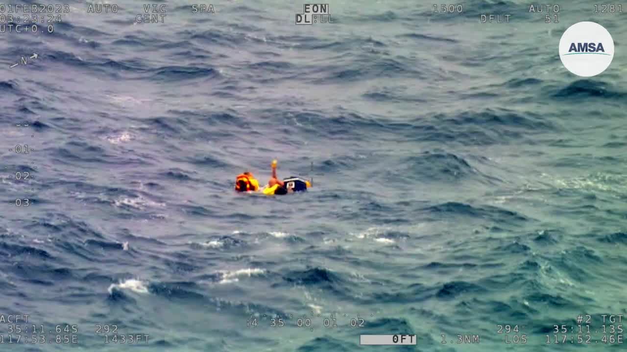 Watch: Fisherman cling to cooler after boat capsizes