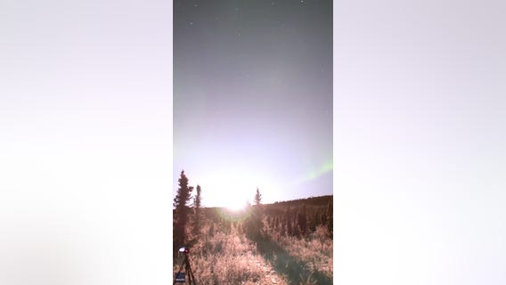 Rocket launches amid beautiful Alaskan aurora