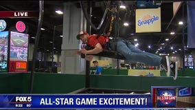 Kevin McCarthy becomes a human claw for prizes at GEICO All-Star Fan Fest