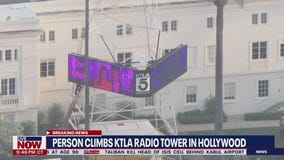 Man climbs KTLA tower in Hollywood holding a 'Free Billie Eilish' sign | LiveNOW from FOX