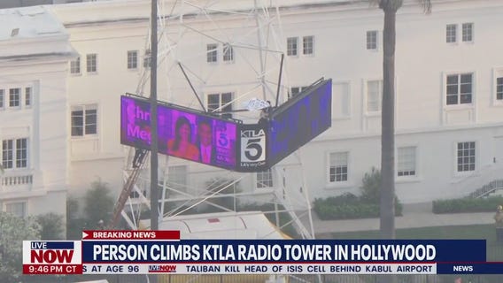Man climbs KTLA tower in Hollywood holding a 'Free Billie Eilish' sign | LiveNOW from FOX