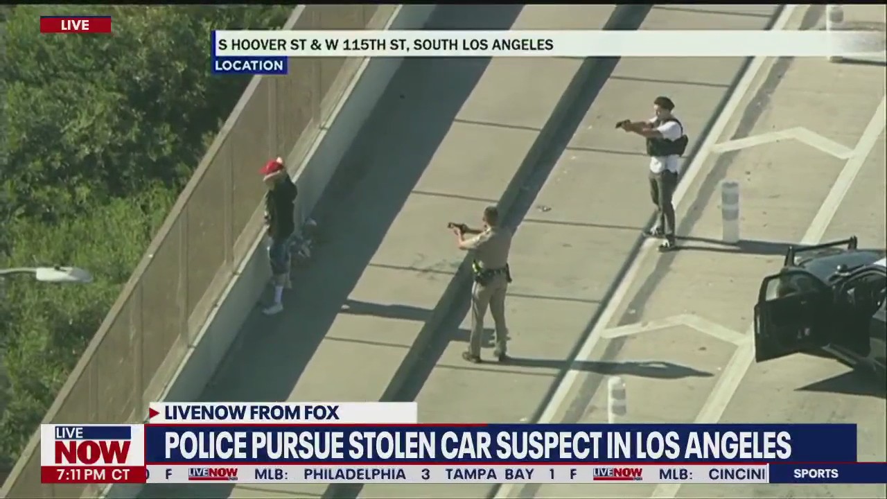 Police chase stolen car in LA: Man tries to casually walk away after ...