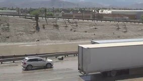 Record rainfall, flooding shuts down freeway