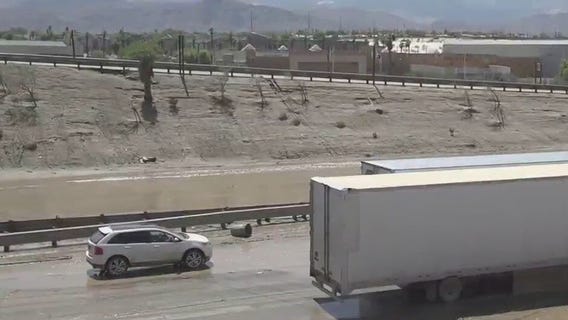 Record rainfall, flooding shuts down freeway