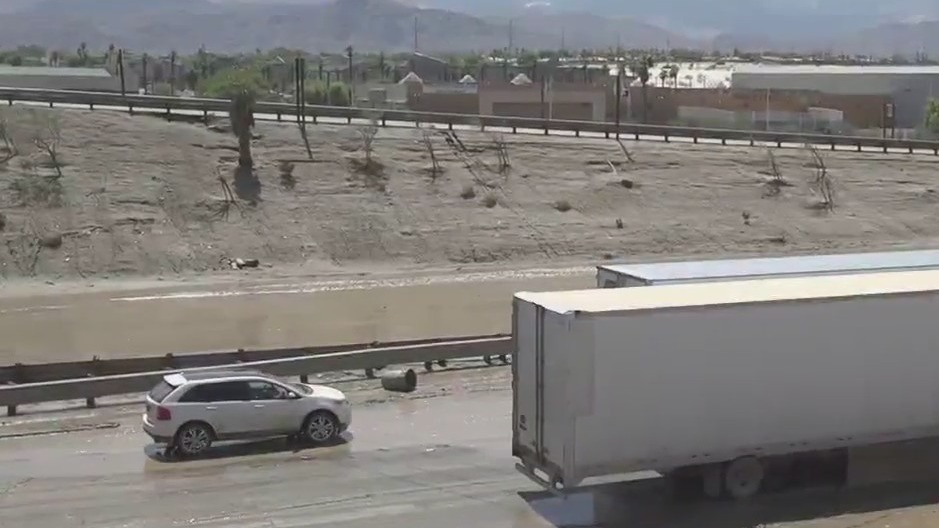 Record rainfall, flooding shuts down freeway