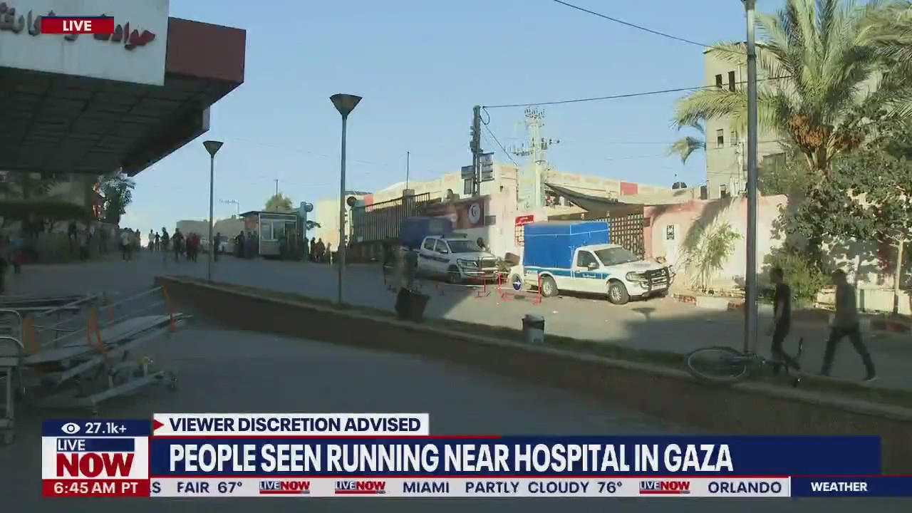 Crowds seen running near Gaza hospital