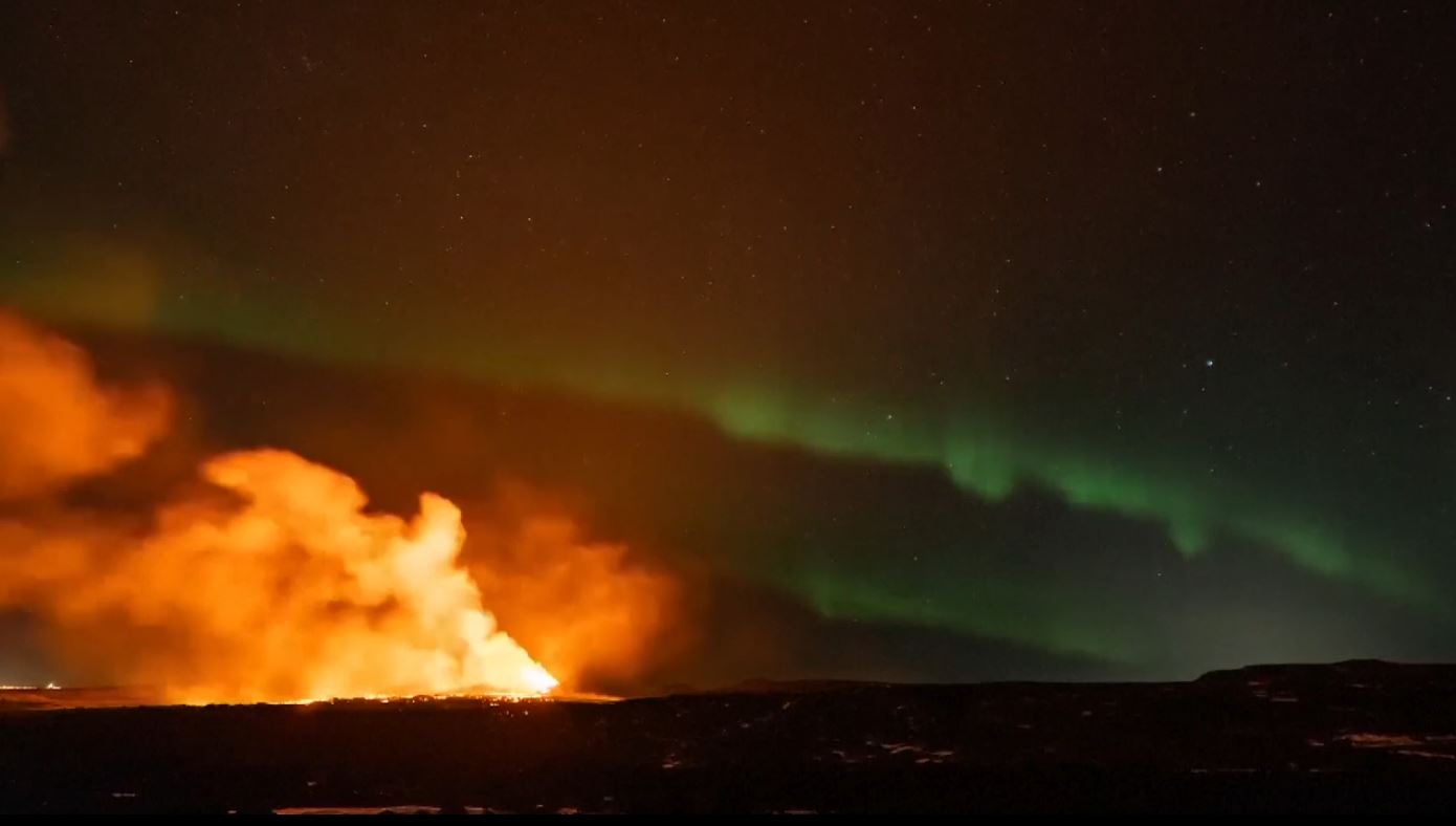 Iceland volcano erupts against backdrop of Northern Lights