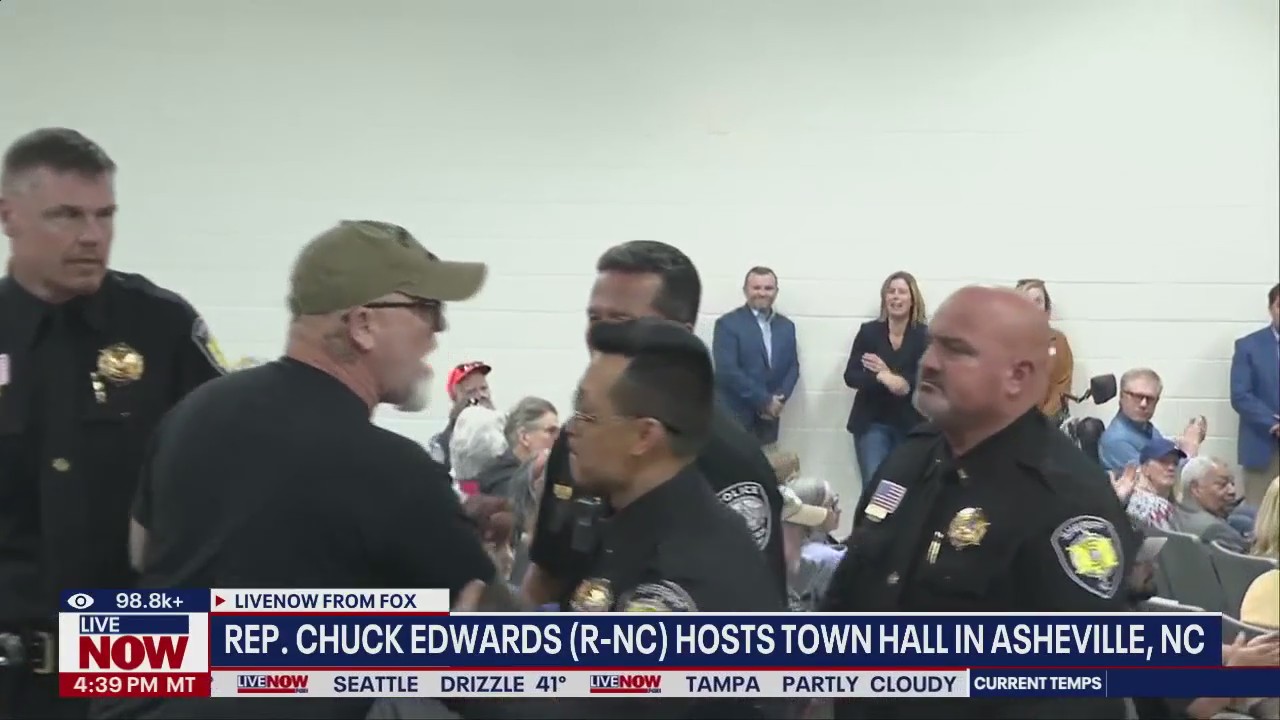 Full town hall as angry citizens confront reps