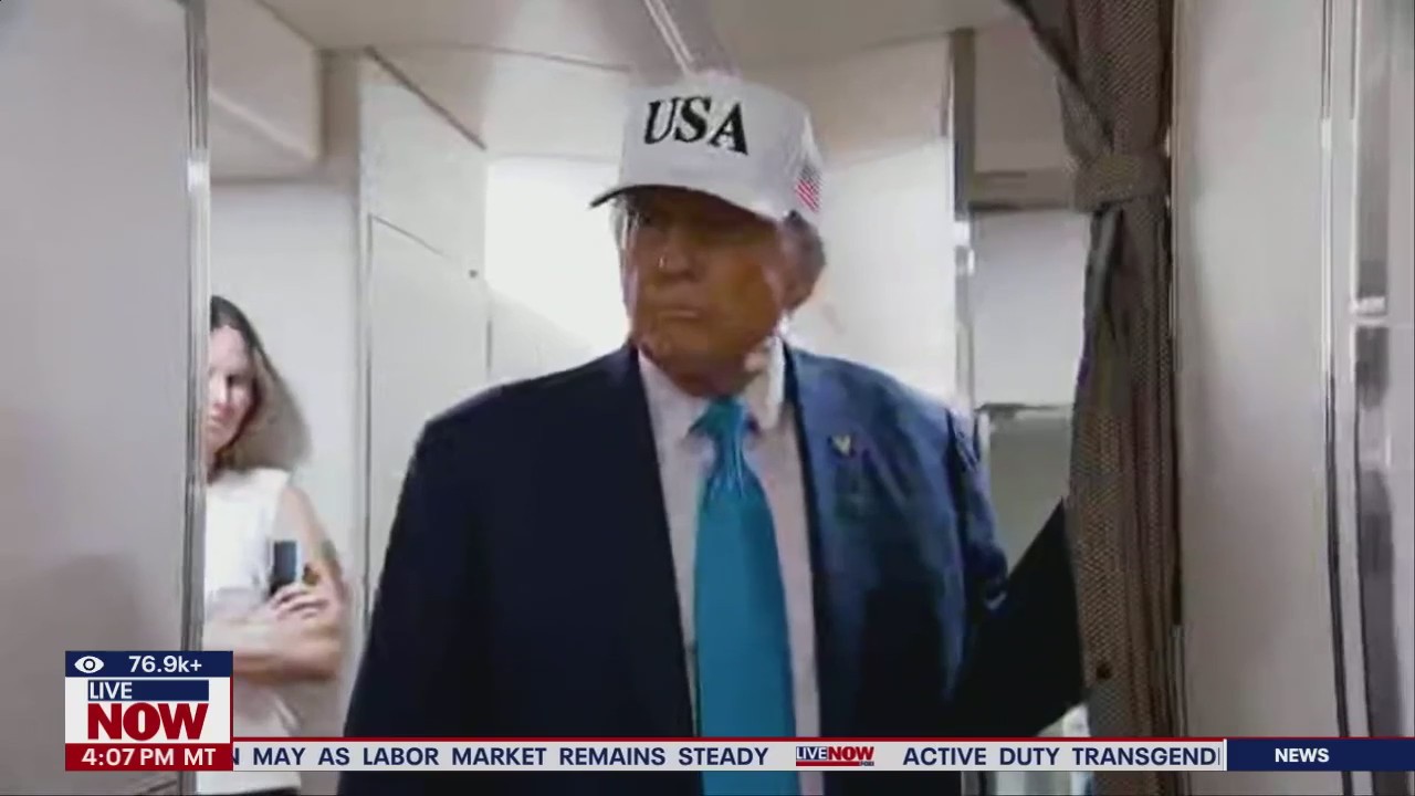 President Trump speaks to reporters on Air Force One