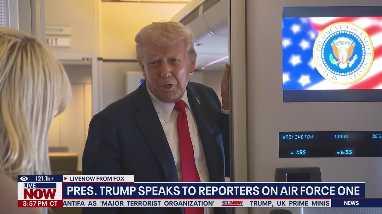 President Trump speaks to reporters on Air Force One