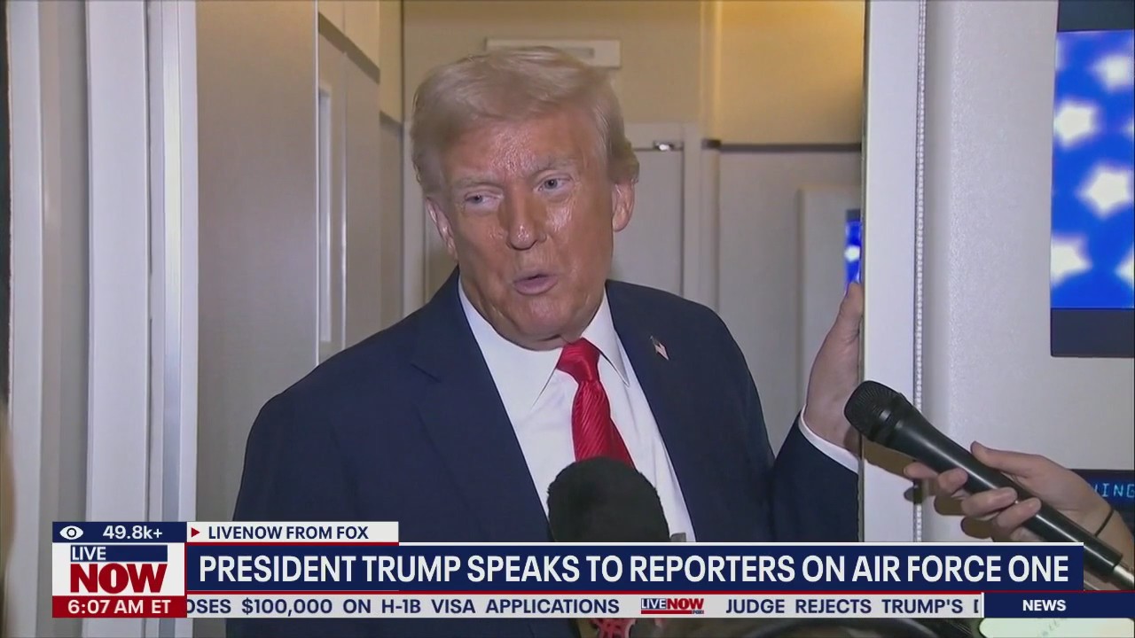 Trump speaks to reporters on Air Force One