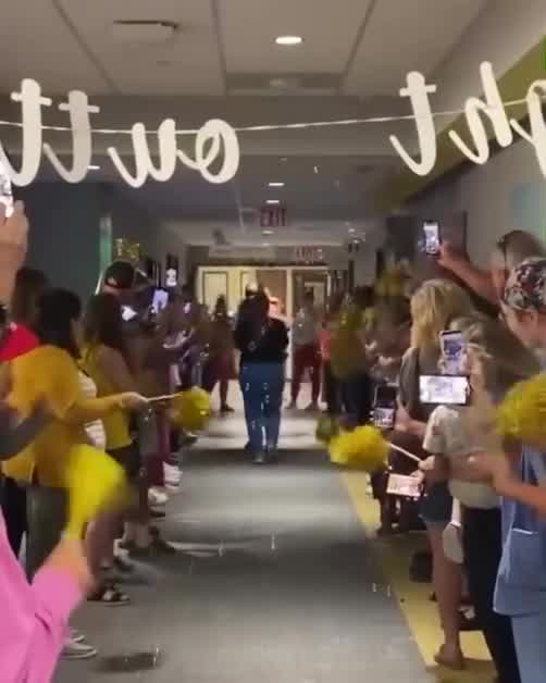 Hospital staff cheer as infant cancer survivor goes home after months of treatment