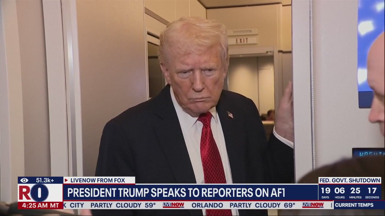 President Trump speaks to reporters on Air Force One