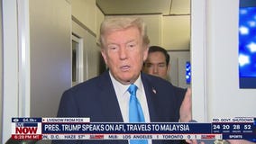 Trump speaks on Air Force One, travels to Malaysia
