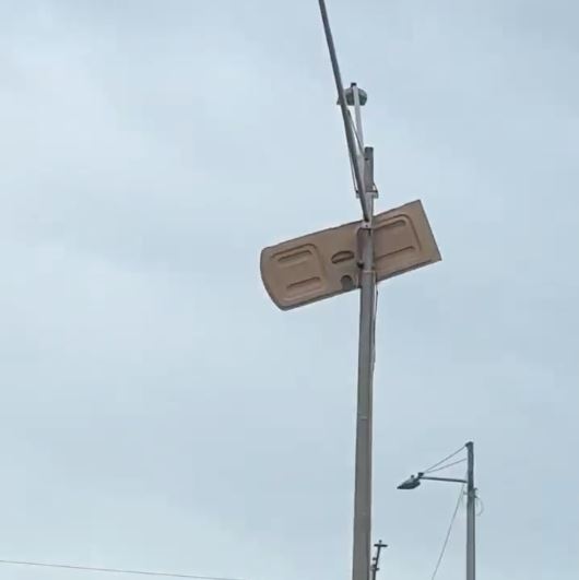 Porta-potty door stuck in pole post-tornado