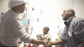 Obama makes surprise visit to hand out gifts to patients at Children's National Medical Center