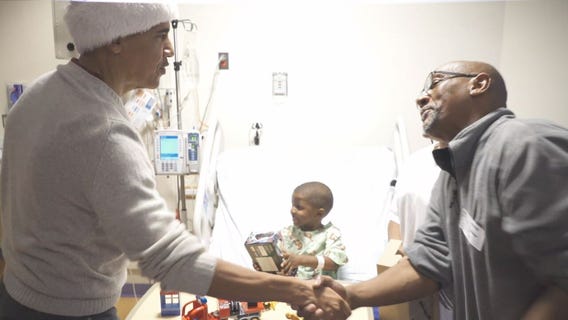 Obama makes surprise visit to hand out gifts to patients at Children's National Medical Center