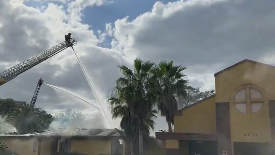 Massive fire collapses roof of building