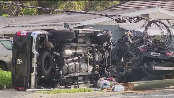 Truck crashes into parked cars, utility pole