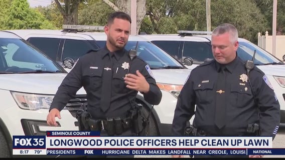 Longwood police officers help clean up lawn