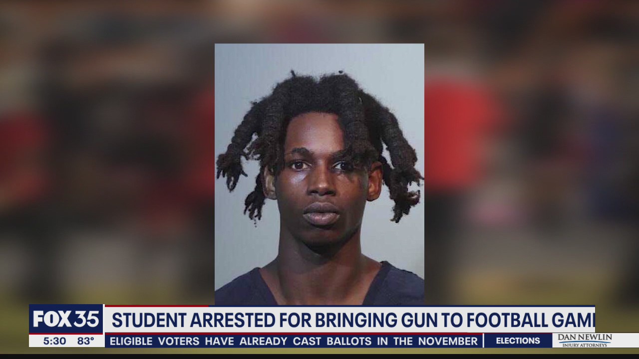 Student accused of bringing gun to football game