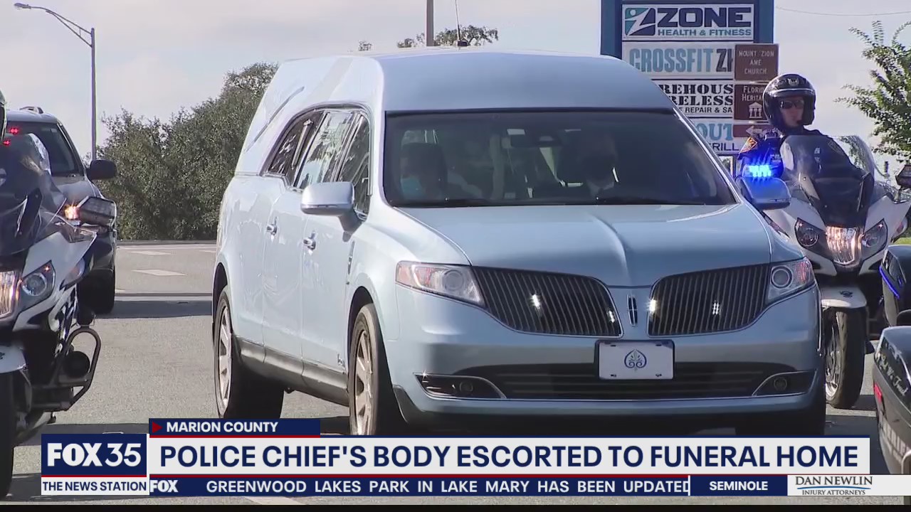 Police chief's body escorted to funeral home